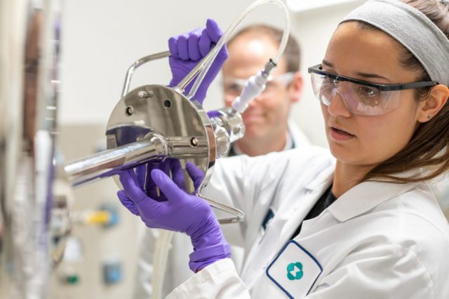 Scientists-RY-Scientist-with-lab-equip-1291-1-LO-900x601