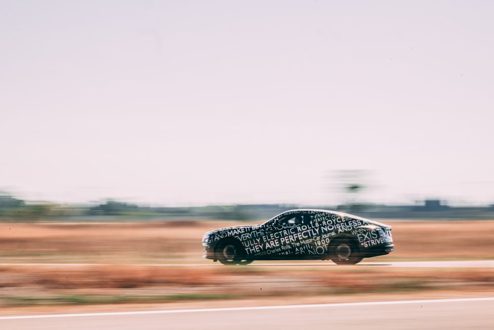 Camouflaged Rolls-Royce Spectre. Lateral motion image.