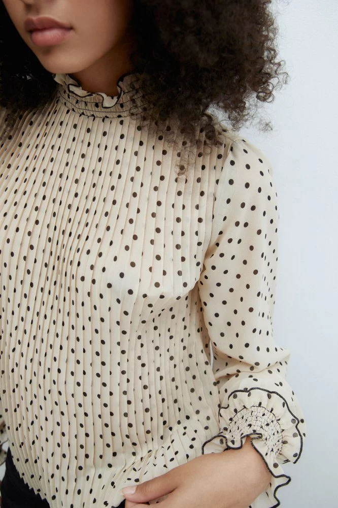 Blusa plisada